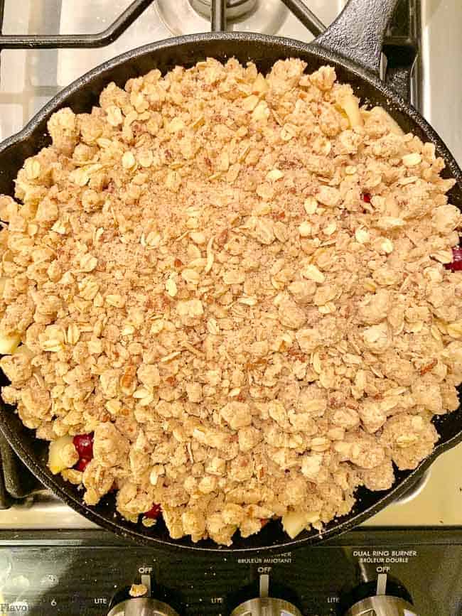 Add crisp topping ingredients to apple cranberry crisp