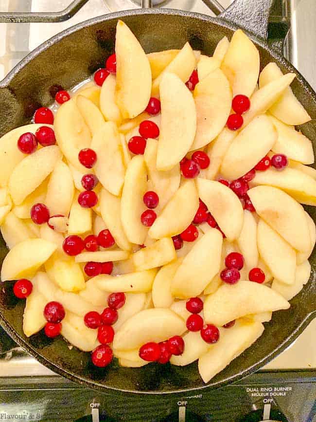 Apples and cranberries in a cast iron skillet