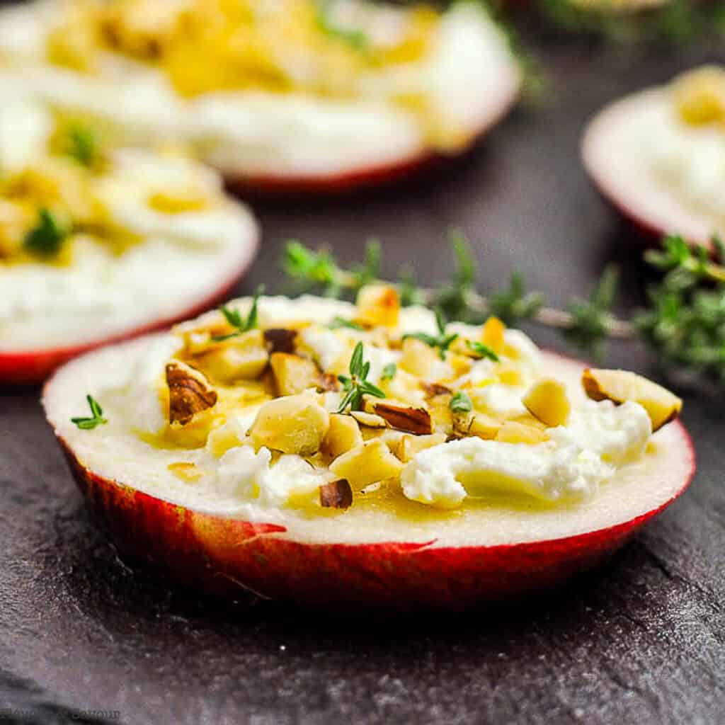 an apple crostini with hazelnuts and honey