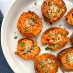 Baked Smashed Sweet Potatoes on round white serving dish
