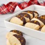 Orange Cardamom Almond Flour Cookies with plaid ribbon in background