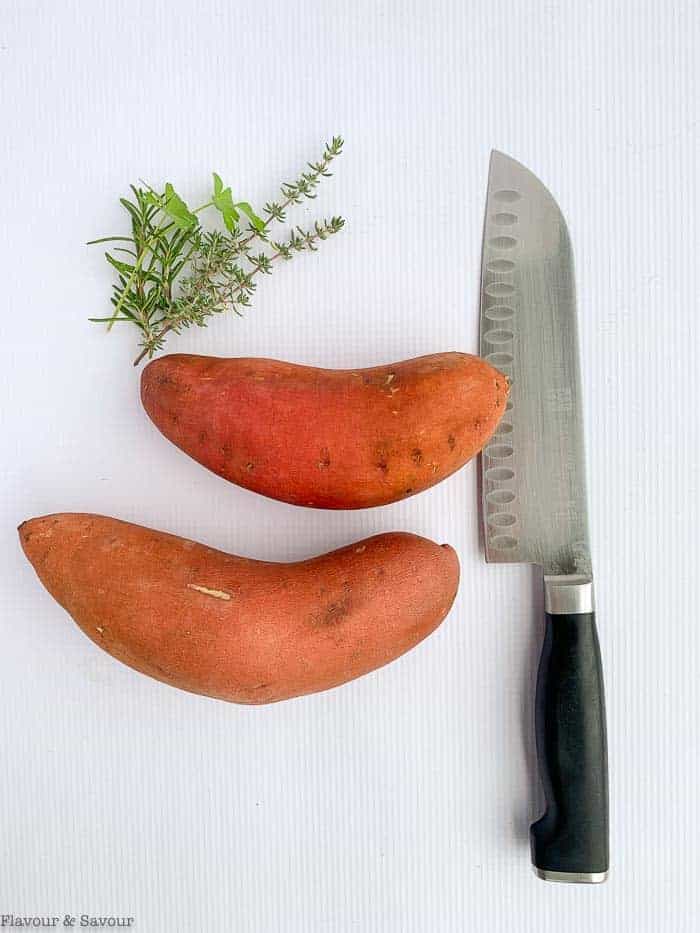 Two medium sweet potatoes and a knife