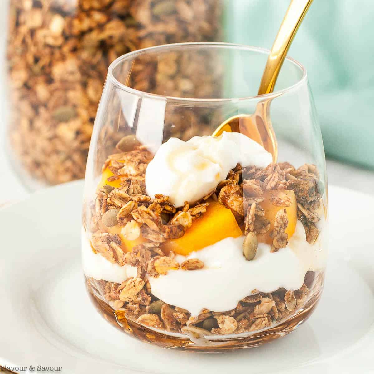 Gingerbread spiced granola parfait with yogurt and fresh fruit.