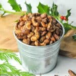gingerbread spiced nuts in a small galvanized bucket