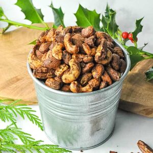 gingerbread spiced nuts in a small galvanized bucket