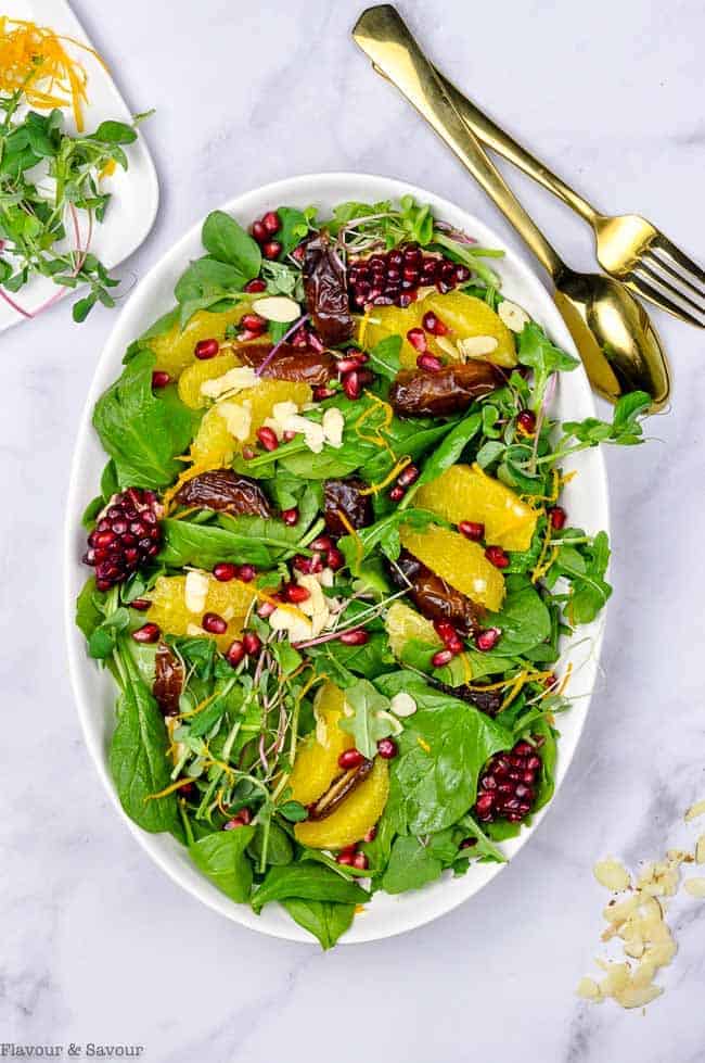 Spinach Salad with Oranges Dates and Pomegranate overhead view