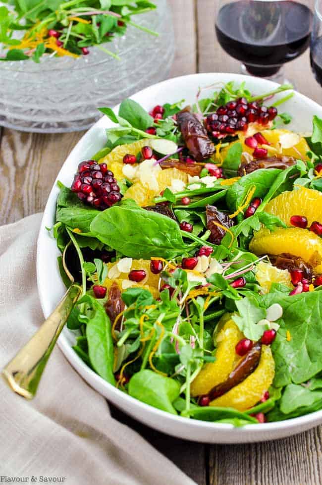 Orange and Date Salad with pomegranate seeds close up view