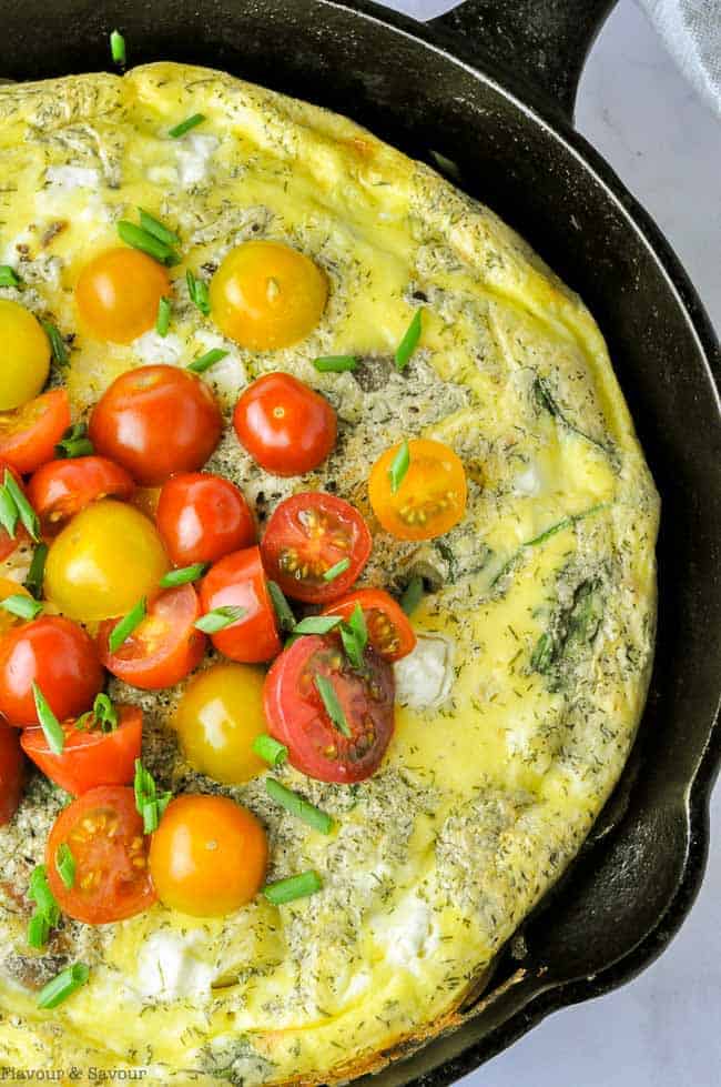 Smoked Salmon Spinach Frittata overhead view of a frittata topped with tomatoes