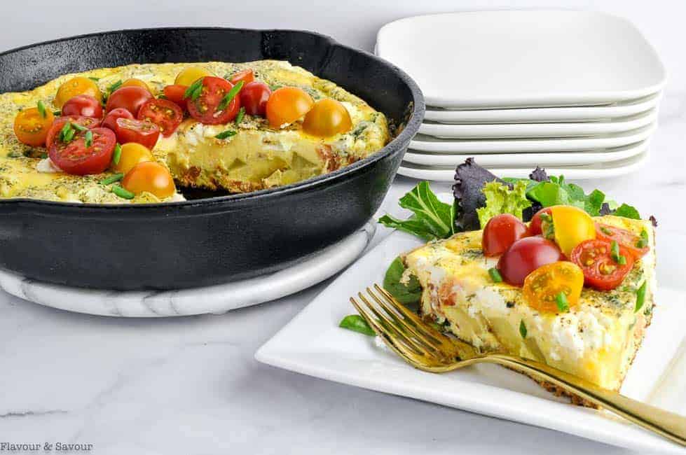 Frittata in skillet and wedge of frittata on a plate