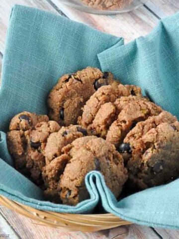 Flourless Keo almond butter chocolate chip cookies in a basket.