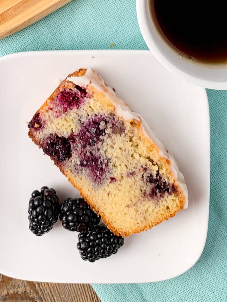 a single slice of Keto Blackberry Bread with fresh blackberries