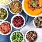 Overhead view of small bowls filled with soup topping ingredients.