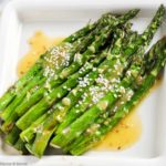 Roasted Asparagus with Sesame Miso Sauce on a square white dish