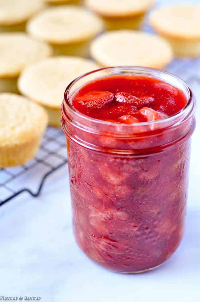 A jar of strawberry sauce.