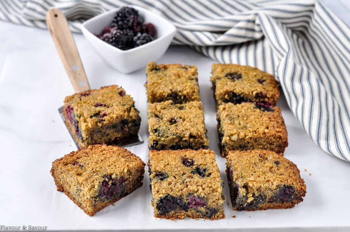 Blackberry Breakfast Bars with a small dish of fresh blackberries