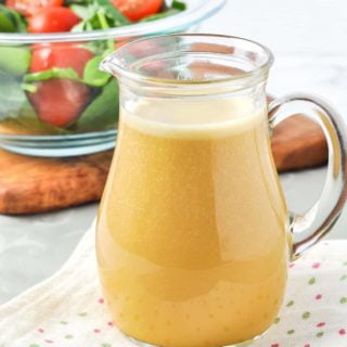 holly hock nutritional yeast salad dressing in a small glass pitcher