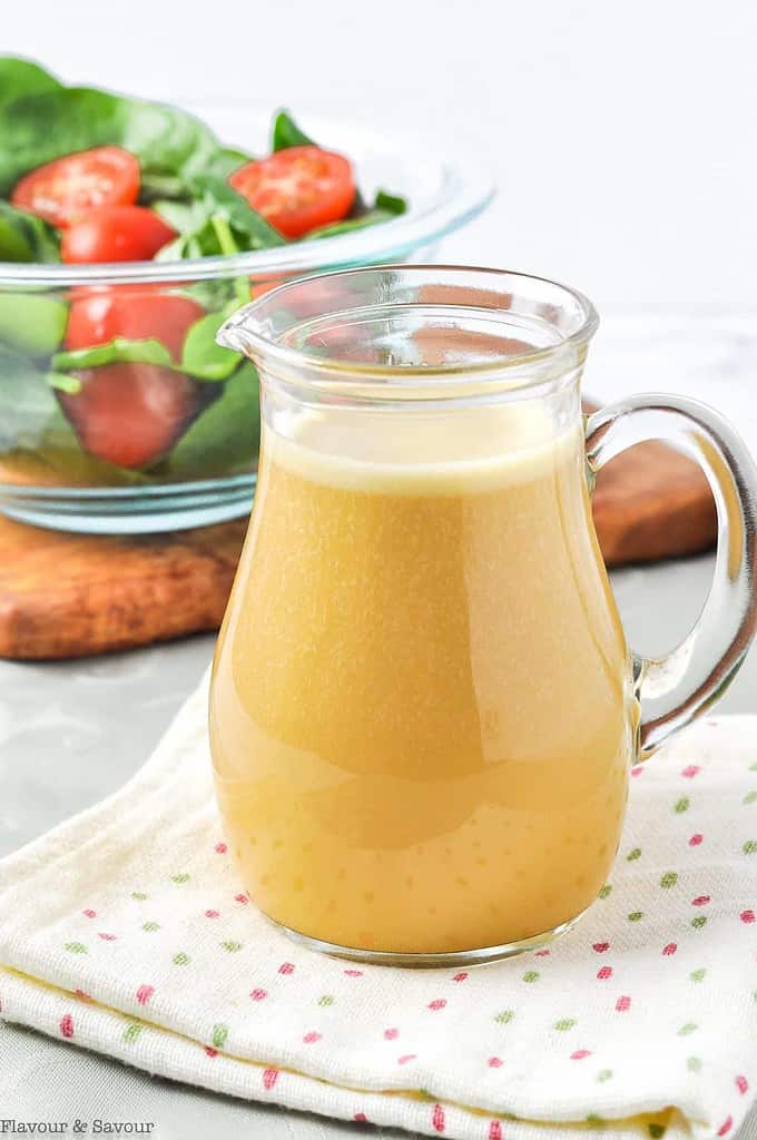 holly hock nutritional yeast salad dressing in a small glass pitcher