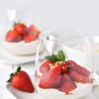 Macerated Balsamic Strawberries with cashew cream in a clear dessert glasses