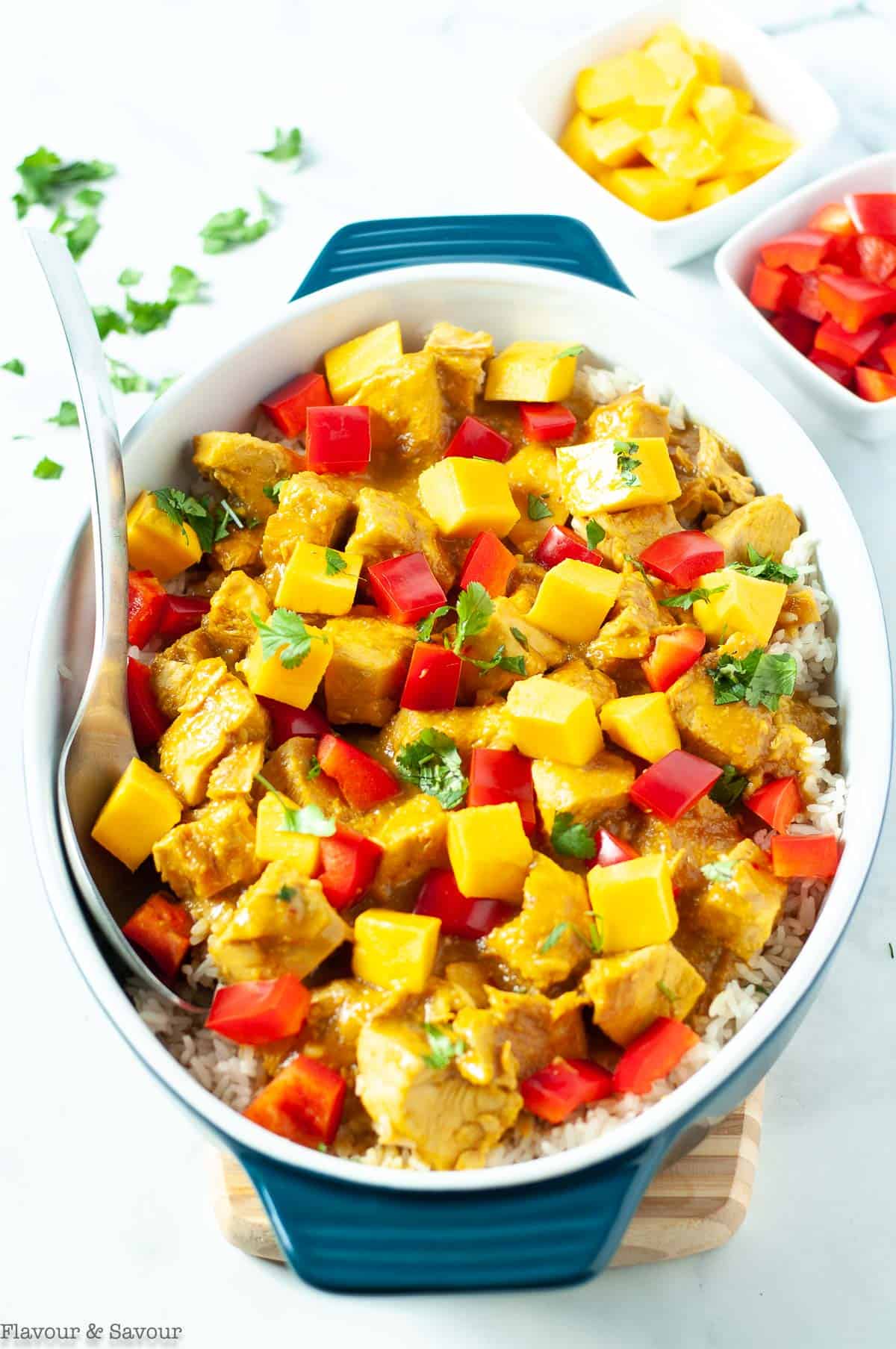 Thai Mango Chicken garnished with red pepper and diced mango.