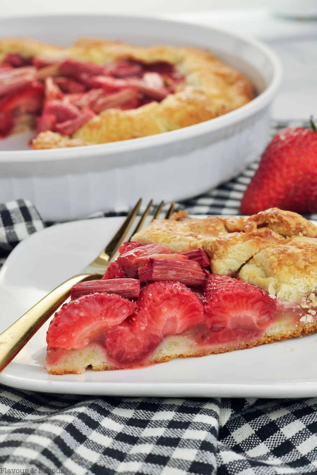 Close up view of a slice of Gluten-free Strawberry Rhubarb Galette