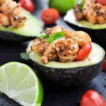 Close up view of Cajun Shrimp Stuffed Avocados with lime