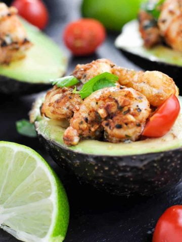 Close up view of Cajun Shrimp Stuffed Avocados with lime