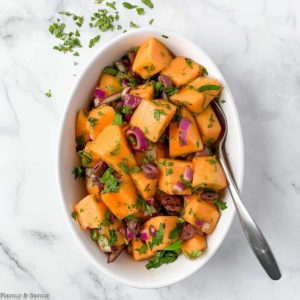 Mediterranean Cantaloupe Salad in a white oval bowl