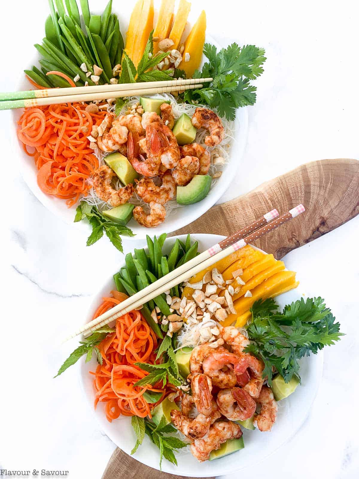 Two Vietnamese Prawn (Shrimp) Noodle Bowls on a board with chopsticks