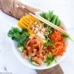 Overhead view of Vietnamese Prawn Noodle Bowl on a board with chopsticks