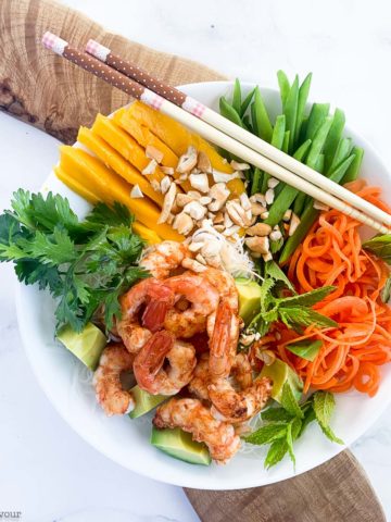 Vietnamese Prawn Noodle Bowl on a board with chopsticks.