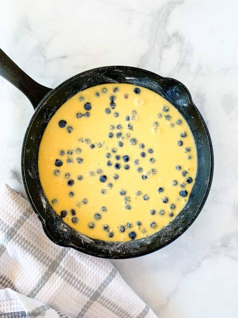 Adding clafoutis batter to skillet