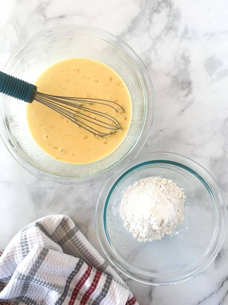 Wet and dry ingredients in two glass bowls