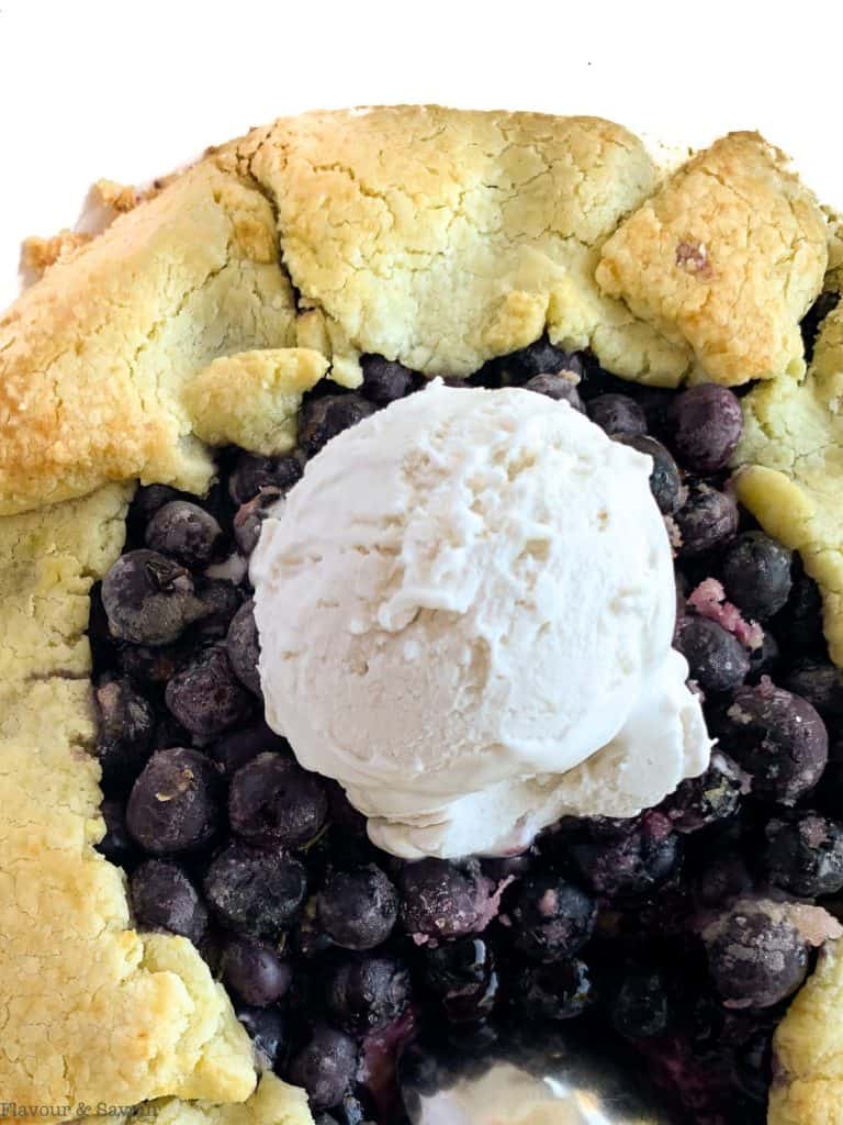 Close up overhead view of Blueberry Lemon Ginger Galette with a scoop of ice cream