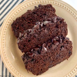 Three slices of double chocolate zucchini bread with chocolate chip topping