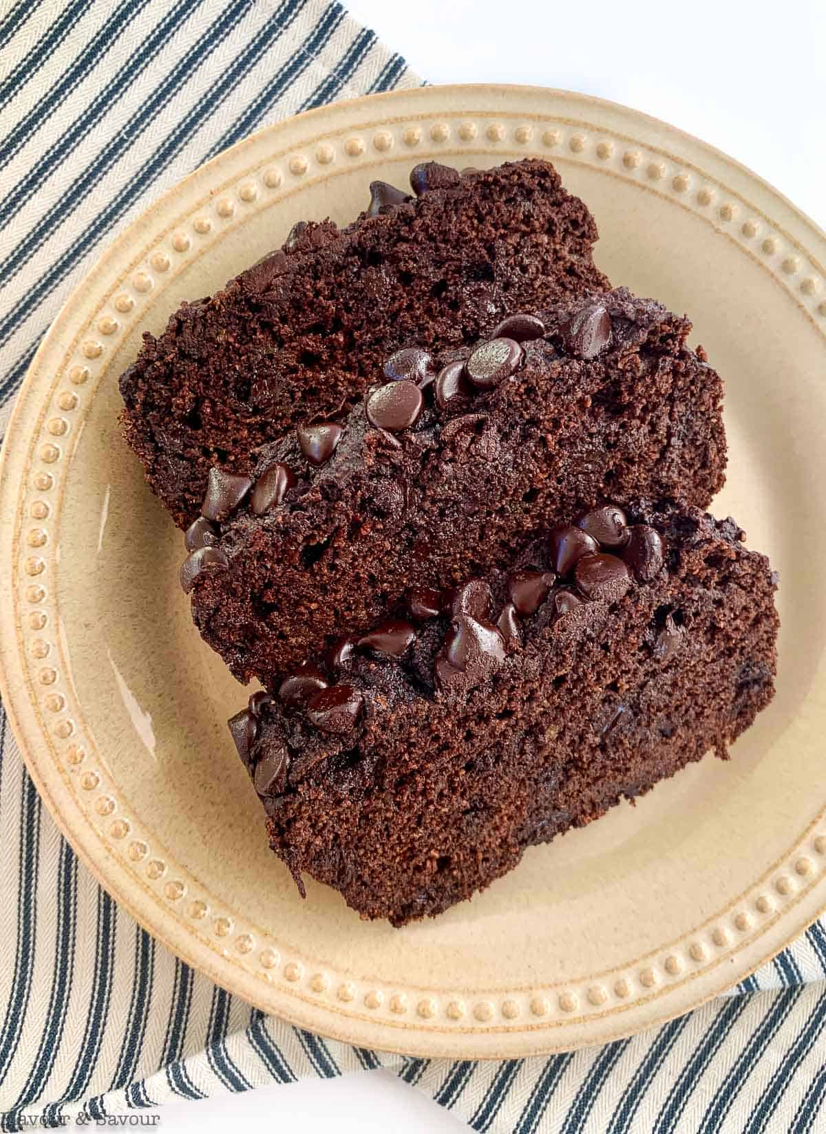Three slices of Grain-Free Double Chocolate Zucchini Bread on a plate