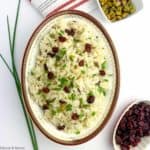 A bowl of Cranberry Pistachio Jasmine Rice with chives