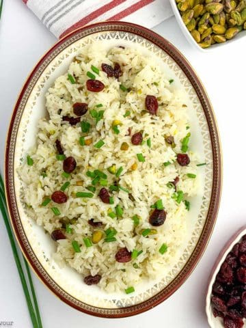 A bowl of Cranberry Pistachio Jasmine Rice with chives