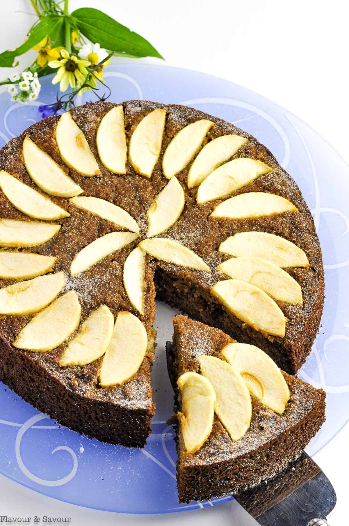 Gluten-free applesauce spice cake on a blue plate.