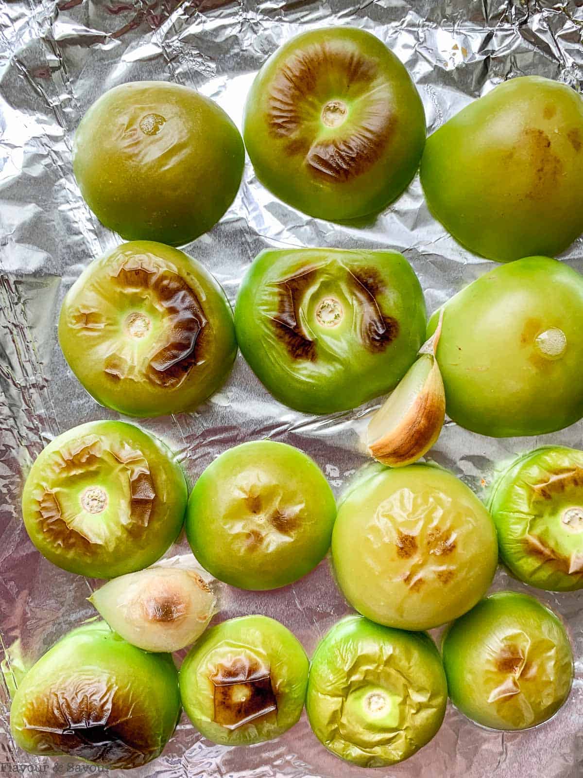 Roasted Tomatillos on a foil-lined baking sheet