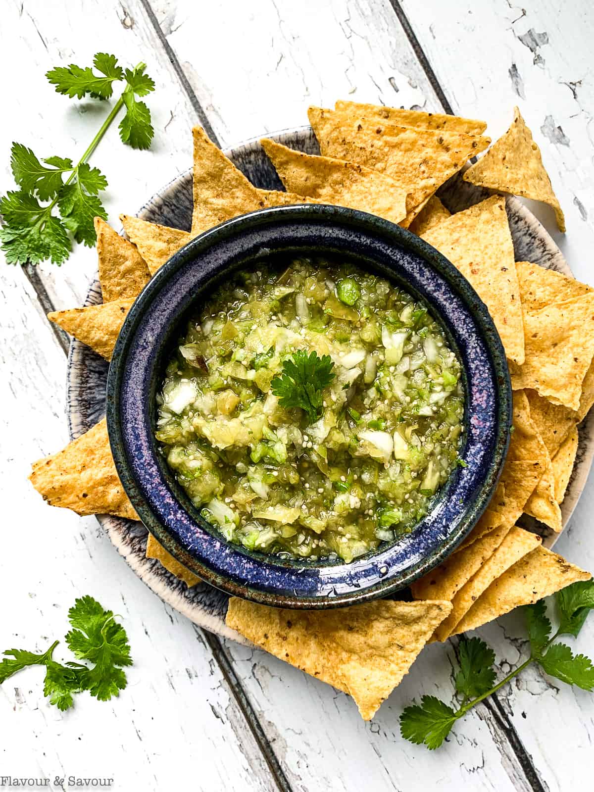 Roasted Tomatillo Salsa Verde surrounded by tortilla chips