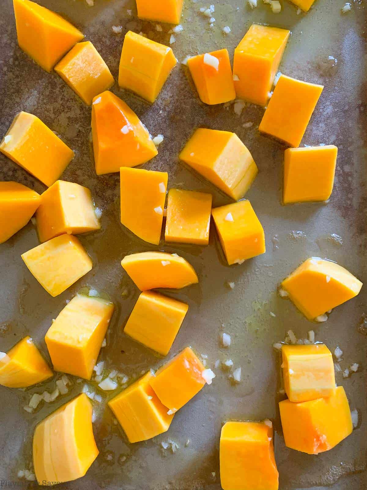 Arrange the cubes on a baking sheet.