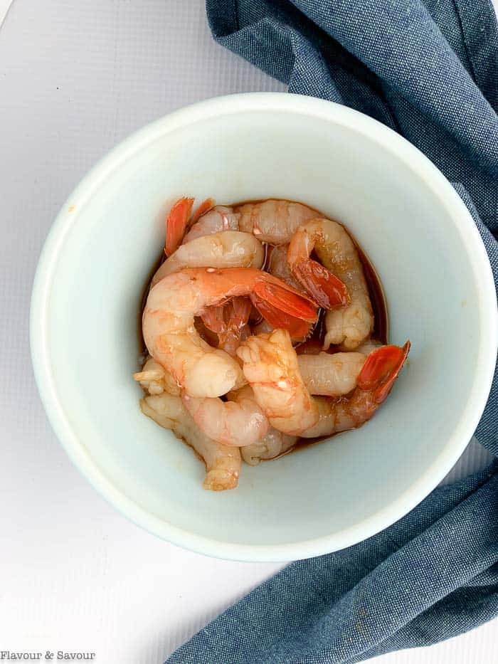 Peeled prawns in a small bowl for shrimp stir fry.