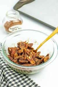 Pumpkin Spice Pecans in a bowl with a spoon