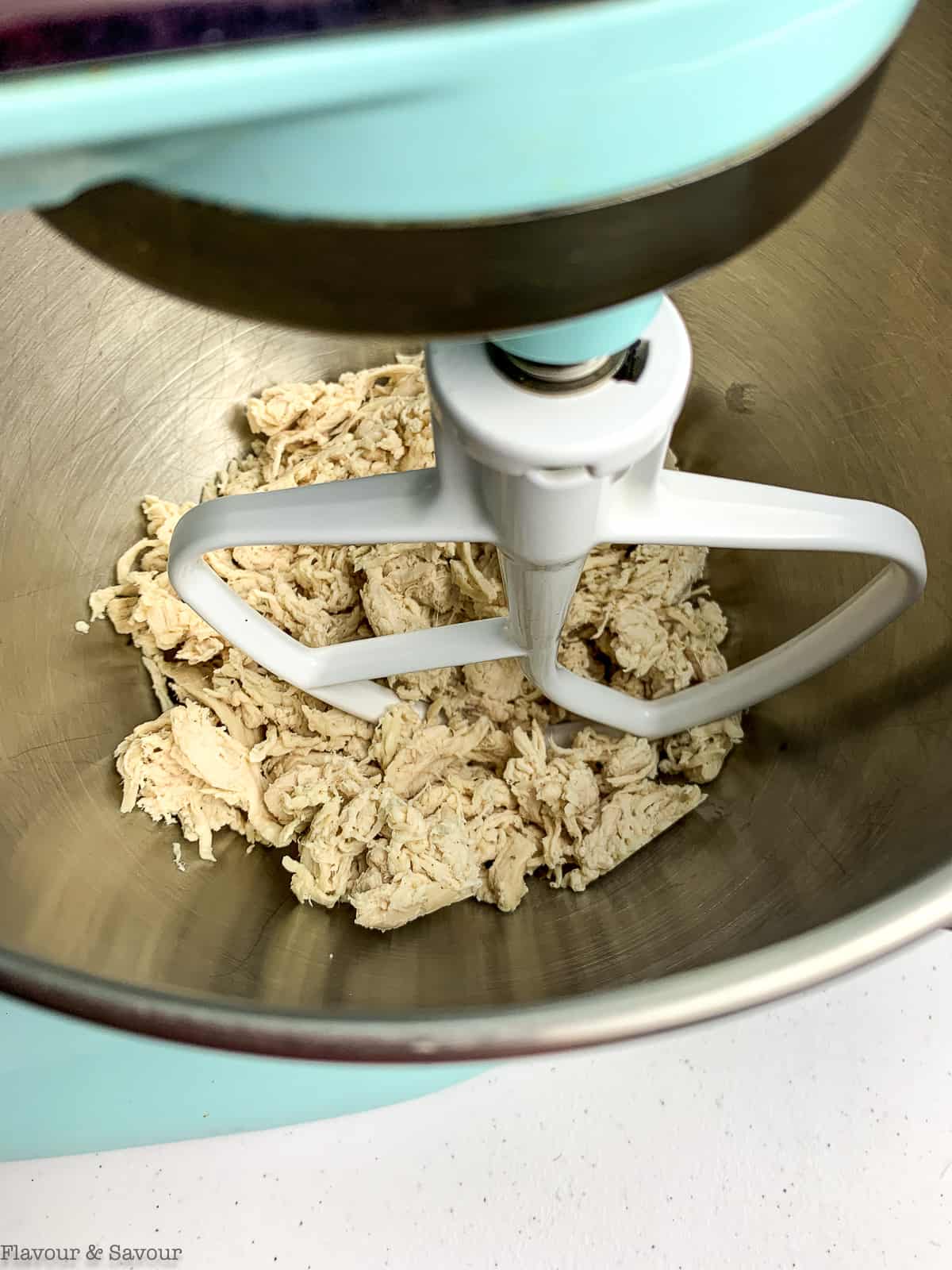 Shredding chicken with a stand mixer.