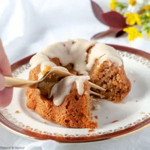Cutting into a Mini Apple Bundt Cake with a fork