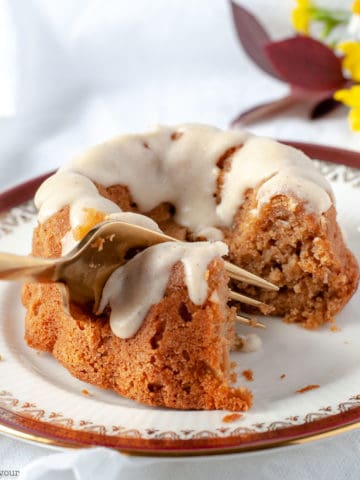 Cutting into a Mini Apple Bundt Cake with a fork