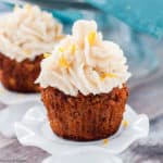 a Paleo Carrot Cake Cupcake on a pedestal stand