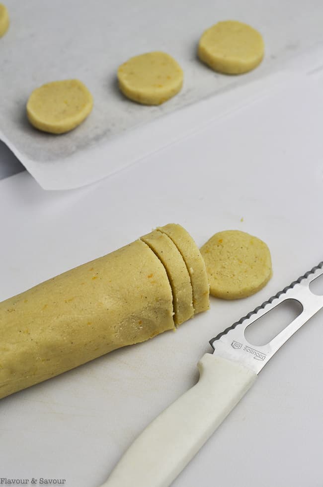 Slicing dough for slice and bake cookies.