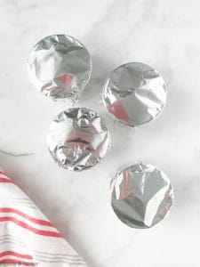 Four ramekins covered in foil