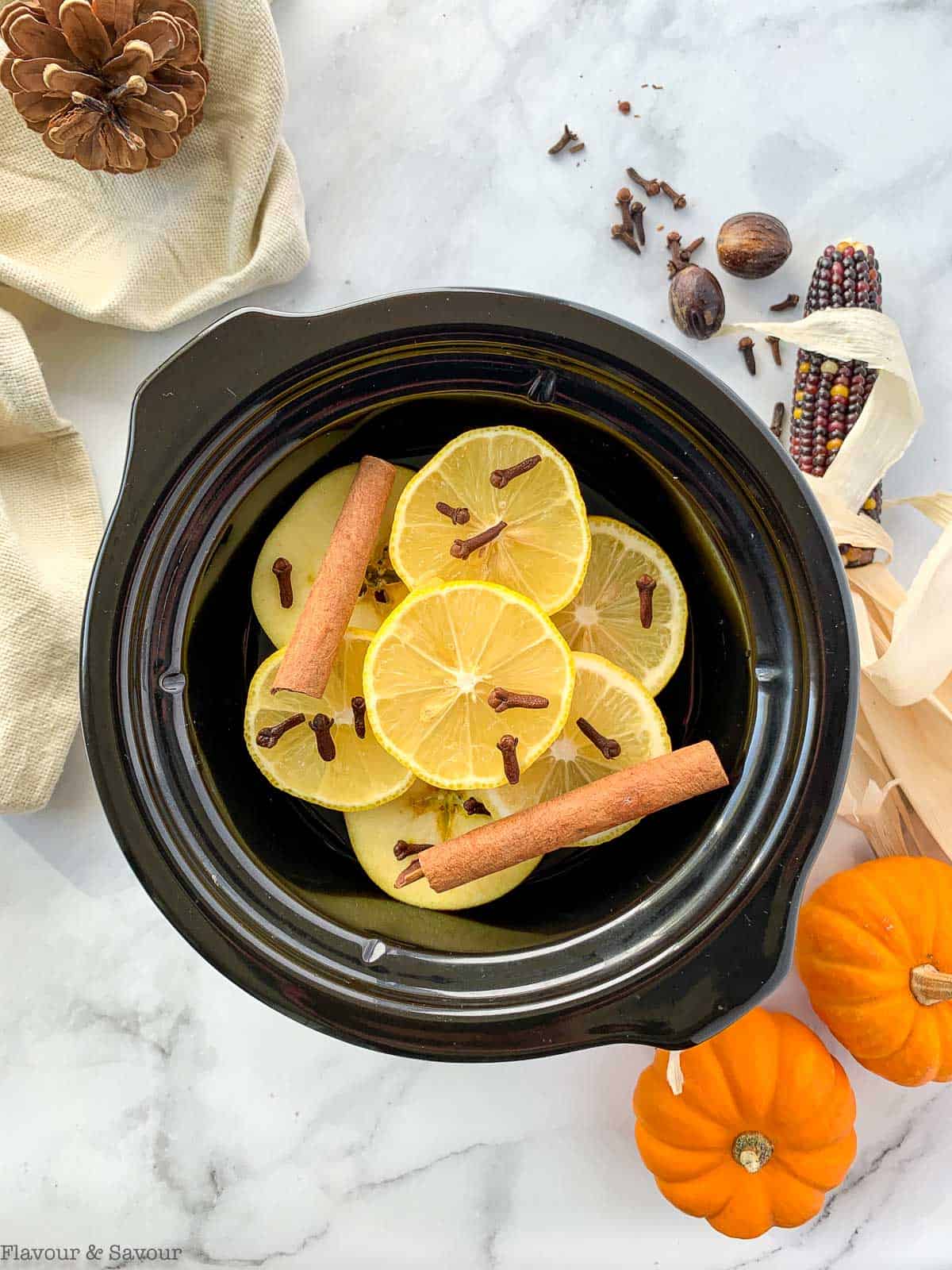 Overhead view of Simmering Fall Potpourri in a mini slow cooker